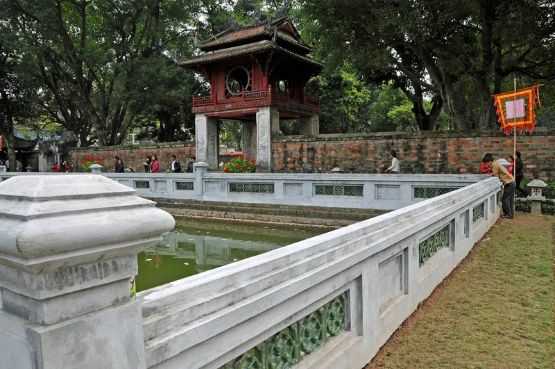 The Khue Van Cac pavilion sits behind a stone-railed pond at the Temple of Literature in Hanoi.