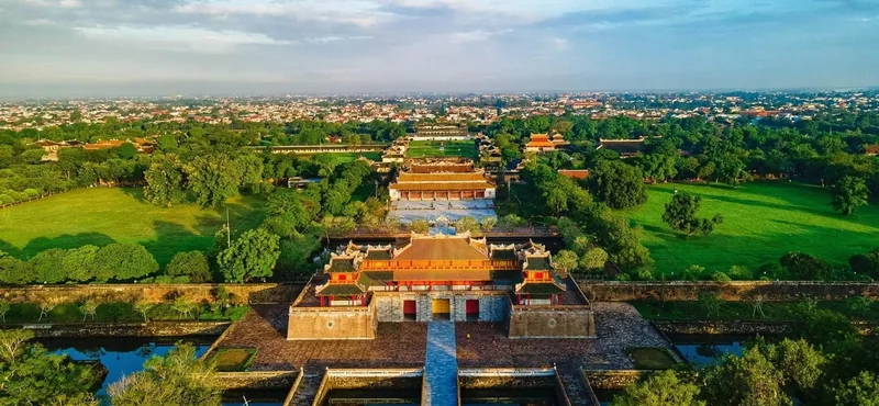 Aerial view of the Imperial City's ancient palaces surrounded by lush greenery in Hue.